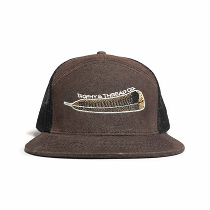 Brown cap with black mesh back and embroidered turkey feather logo on a white background